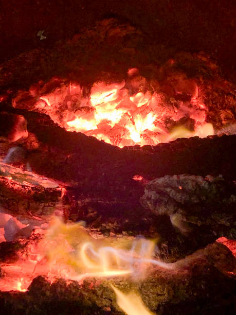 istock Glowing campfire at autumn campsite 2200170944