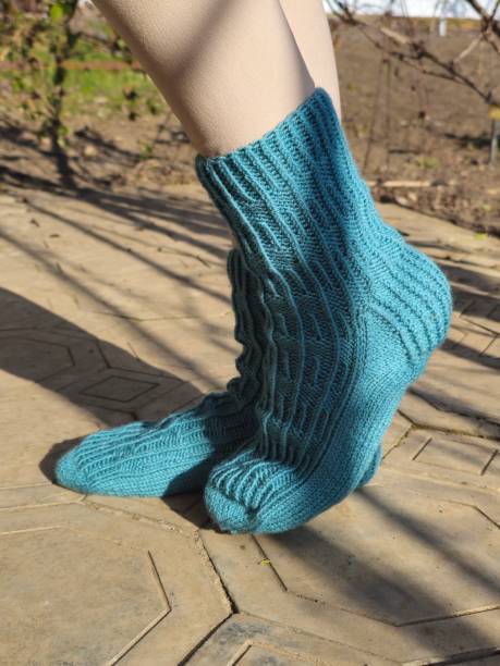 istock A person wearing a blue sock 2200172669