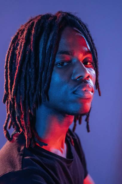 istock Professional portrait. African American guy is studio with neon lighting 2200172885