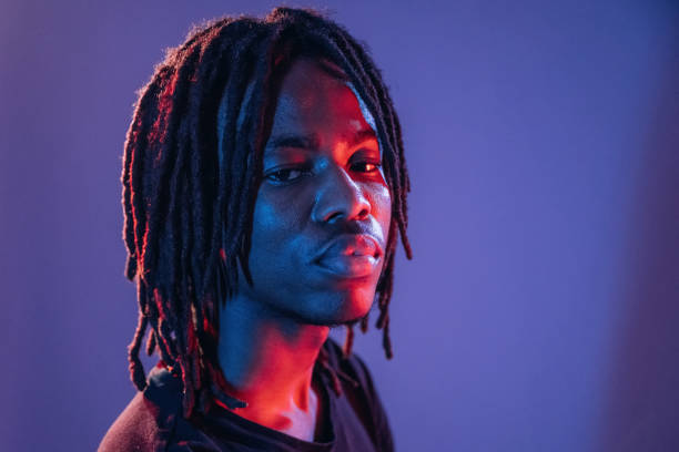 istock Professional portrait. African American guy is studio with neon lighting 2200172891