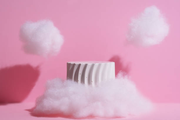 istock Premium scene. A white geometric podium in clouds on a pink background for the presentation of a cosmetic product. Showcase, display case. 2200180130