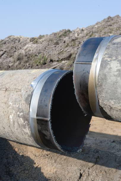 istock Asbestos removal and disposal of a pipeline. 2200180263