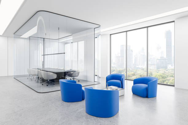 istock Modern open-space office interior with large windows, cityscape view, and rows of desks and chairs. 3D Rendering 2200180472