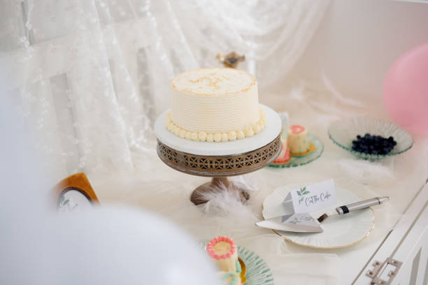 Event, dessert or cake for wedding on pedestal for reception celebration, social gathering and catering. Luxury, blueberry  and table setting for vanilla frosting for elegant decoration,  and party