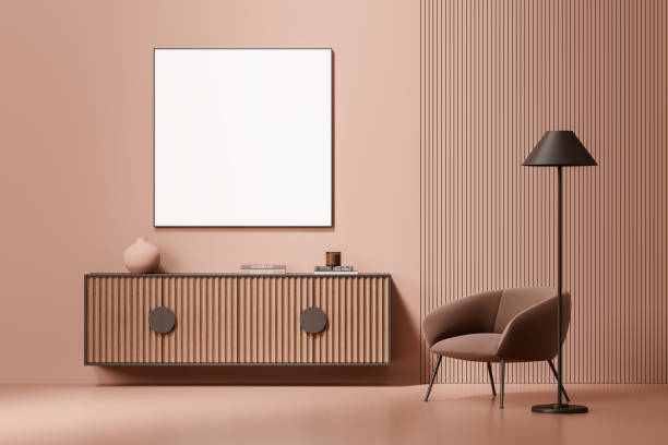 istock Minimalist dining area with modern round table and beige chairs in peach room, separated by textured glass panel. 3D Rendering 2200182056