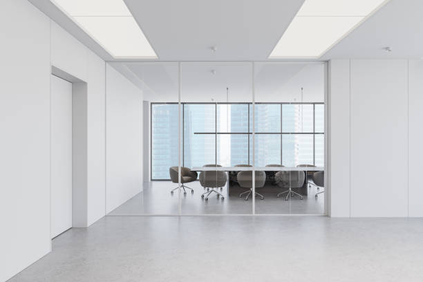 istock Modern open-space office interior with large windows, cityscape view, and rows of desks and chairs. 3D Rendering 2200183052