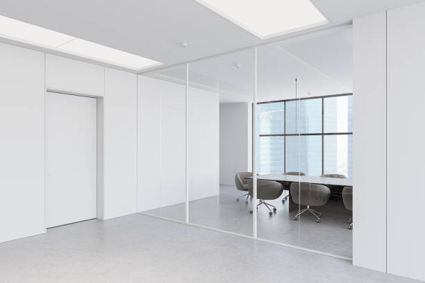 istock Modern open-space office interior with large windows, cityscape view, and rows of desks and chairs. 3D Rendering 2200183162