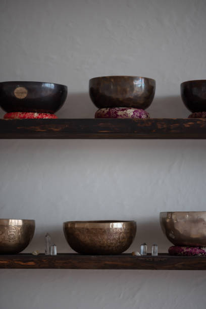 istock Tibetan singing bowls on wooden shelves. 2200183345