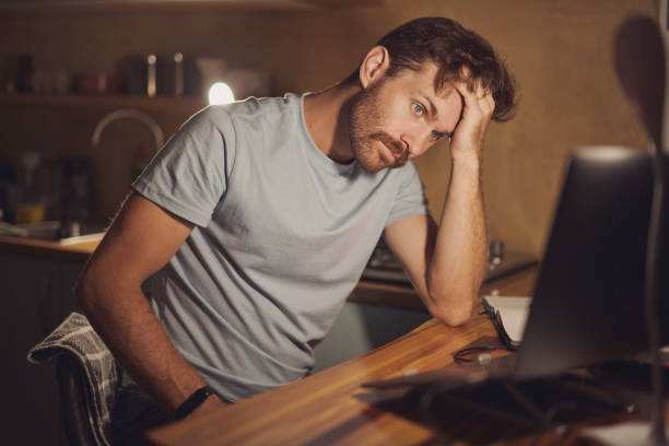 istock Frustrated man, mistake or night with stress on laptop for project deadline, pressure or bankruptcy at home. Male person, journalist or working late with fatigue, headache or strain for fail or debt 2200189026