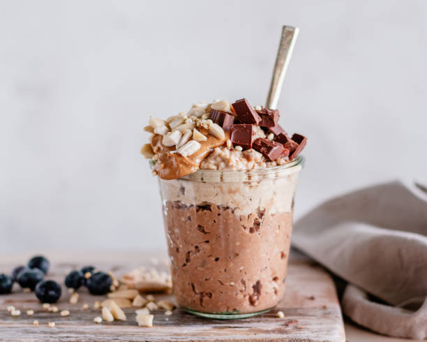 istock Layered cacao and vanilla oatmeal served in a jar 2200189523