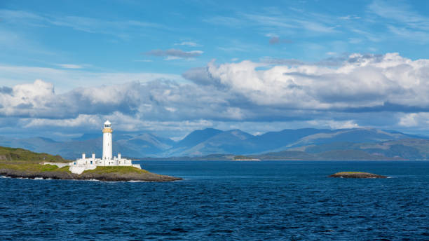 istock Panoramic view of the Lismore Lighthouse, Eilean Musdile, Inner Hebrides. The lighthouse can be seen at the entrance to Loch Linnhe from the Oban to Mull ferry. 2200189848