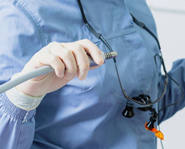 istock Dentist holding dental drill preparing for teeth examination 2200191637