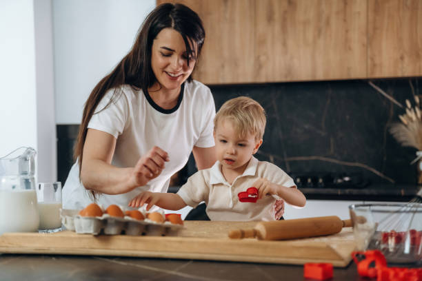 istock Mother and son are preparing bakery at home 2200191804