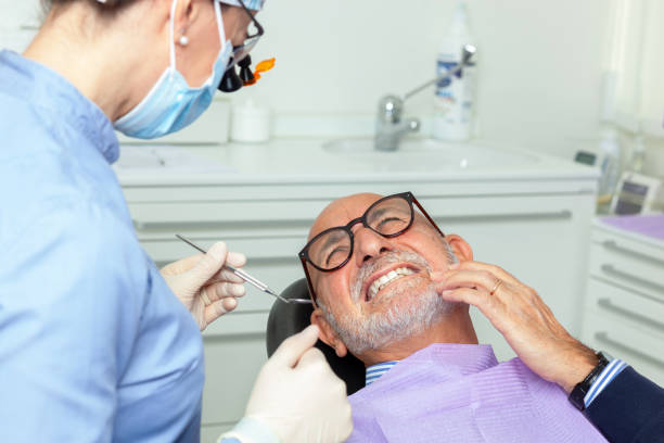 istock Senior man feeling toothache during dental examination 2200192659