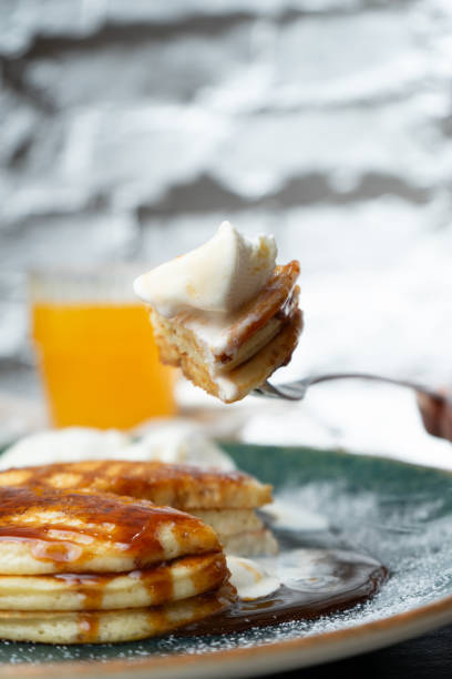 istock Pancakes with salted caramel and vanilla ice cream on a bar table 2200195417