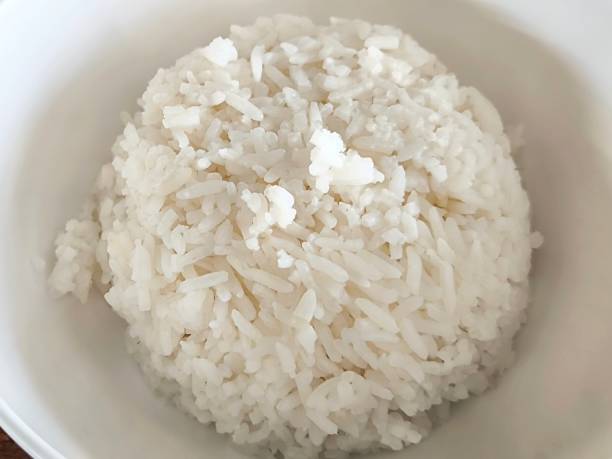 istock Cooked rice in ceramic bowl. Food menu concept 2200195525