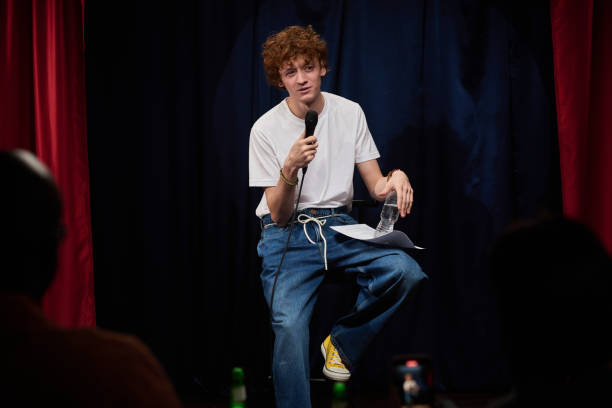 istock Performing Stand-Up Comedy on Stage with Microphone 2200195916