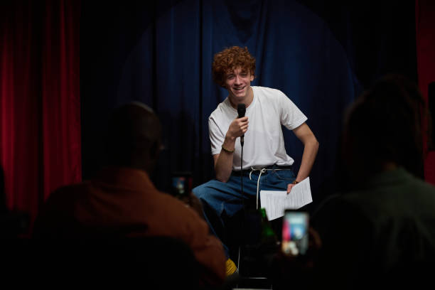 istock Smiling Comedian Performing Stand-Up in Comedy Club 2200195940