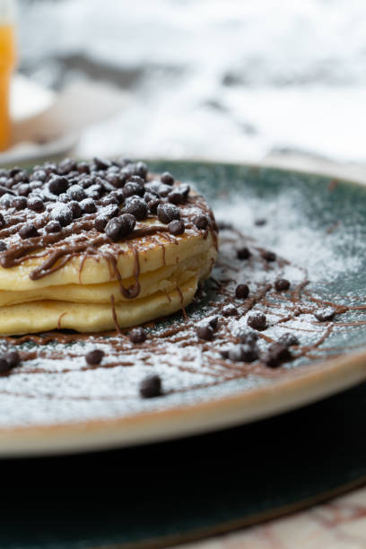 istock Chocolate and nutella pancakes on a bar table 2200196356