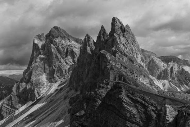 istock Monochrome shot of Seceda Ridge in Italy Dolomites, featuring sharp rock formations and steep slopes. The timeless black and white effect creates a striking and nostalgic visual 2200196974