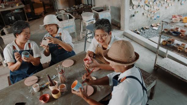 istock Elderly Women Celebrating Friendship and Creativity at a Pottery Workshop 2200199742