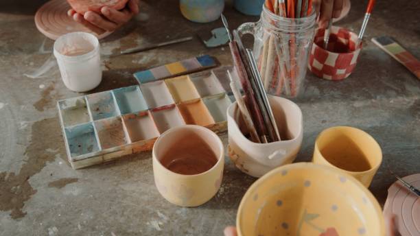 istock Pottery Painting Workshop with Brushes, Ceramic Pieces, and Color Palette 2200199753