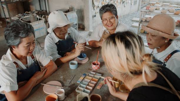 istock Elderly Friends Bonding Over Pottery Painting in a Studio Workshop 2200199771
