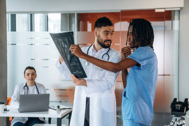 istock X-ray in hands, researching. Doctors are in the clinic 2200200093