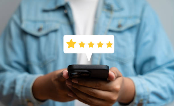istock Experience excellent customer service, User give five star rating on online application, Positive feedback, Happy, Smiley face icon. Customer Reviews in Digital Survey, Satisfaction. 2200200480