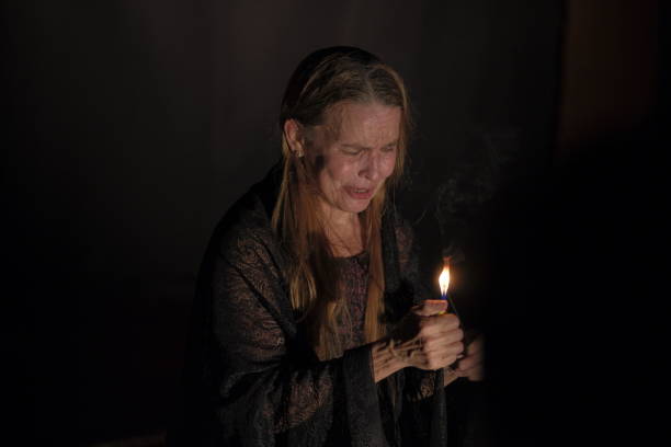 istock Older adult woman with dramatic gestures on theatrical stage. 2200201537