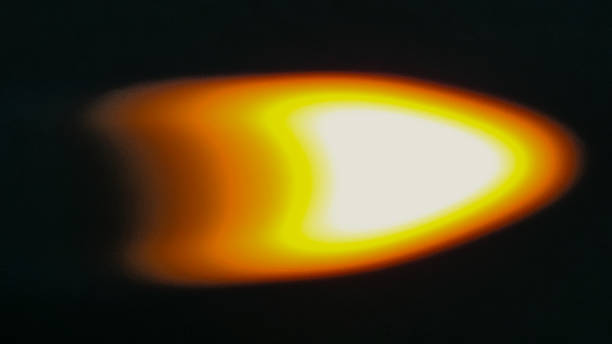 istock abstract bright fire flame defocused science orange yellow fire boke light isolated on black background 2200202087