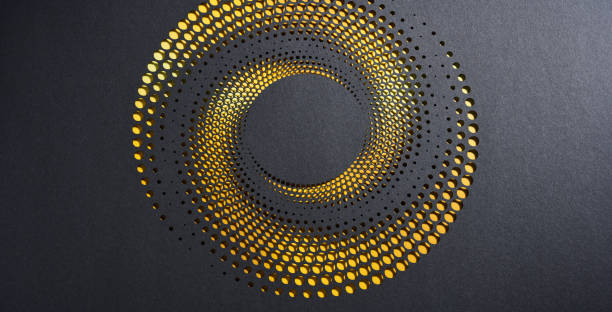 istock Intricate spiral cut paper artwork with golden gradient on black background, creating a mesmerizing abstract design 2200203009