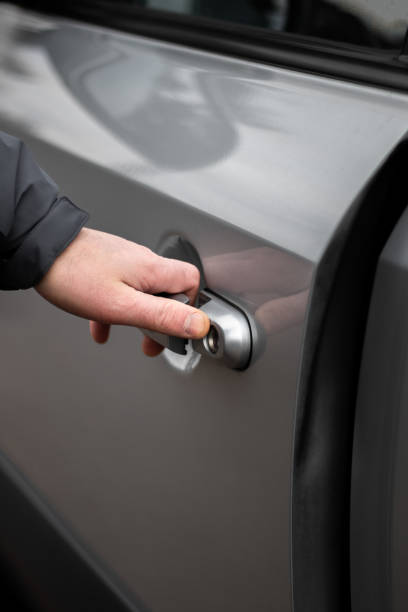 istock Man’s Hand Opening Car Door Close-Up 2200204012