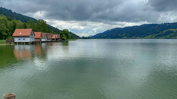 istock Tranquil Lake with Lakeside Houses and Mountain View 2200204379