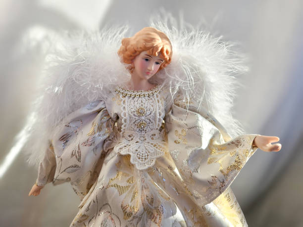 istock close-up ethereal winged feathery angel ornate holiday decorative light effect figure statue backdrop 2200206540
