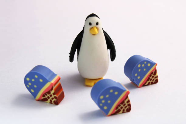 istock Penguin next to three ice cream with wafers 2200207055