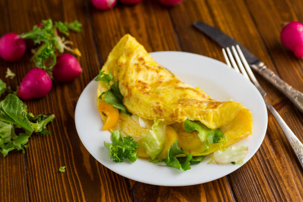 istock egg roll with sweet pepper and salad, on a wooden table 2200207176
