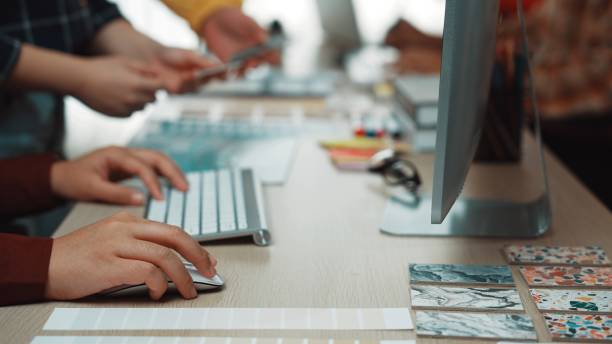 istock Hands of creative professionals collaborating in a modern workspace with digital tools and color swatches, illustrating teamwork and design inspiration SACTR 2200207641