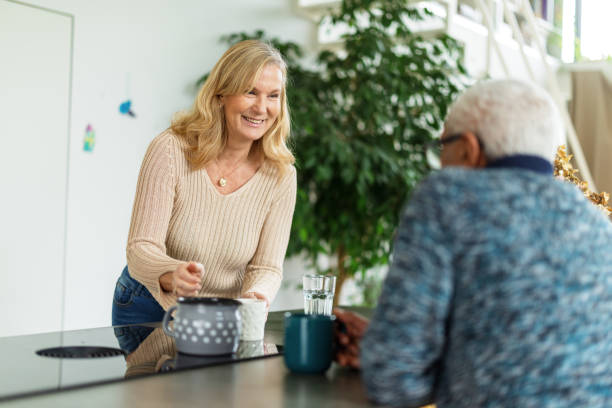 istock Senior Couple Enjoying Coffee at Home 2200209312
