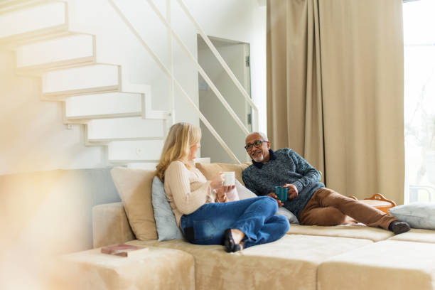 istock Senior Multiracial Couple Relaxing at Home 2200209313