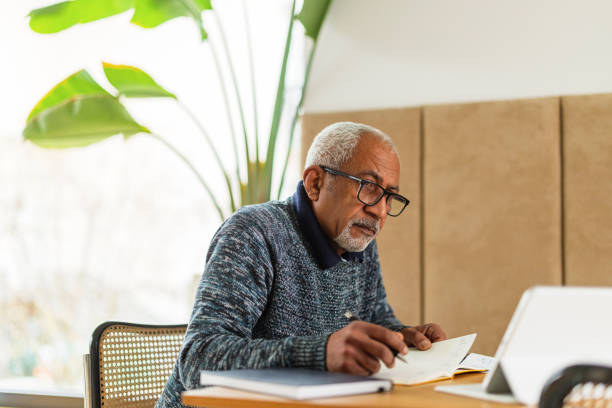 istock Thoughtful Senior Man in Home Office 2200209406