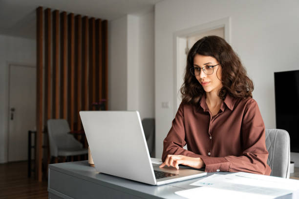 istock Young freelance business woman using laptop computer for online remote programmer work. Latin hispanic or middle eastern girl student watching webinar studying lesson. Businesswoman working remotely 2200209523