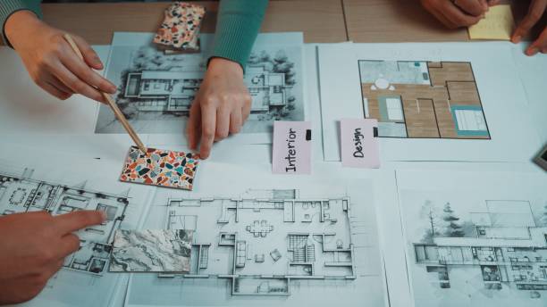 istock Collaborative Workspace for Interior Design Project with Architectural Plans and Colorful Materials Spread on Table SACTR 2200210719
