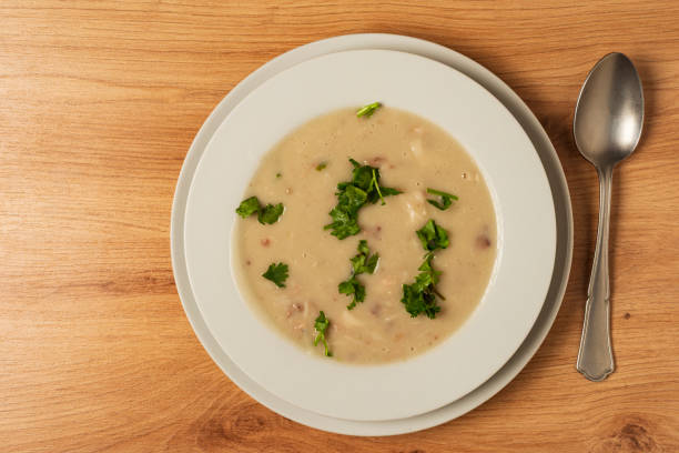 High angle view of delicious healthy grouper soup made with ocumo tuber a healthy ingredient.