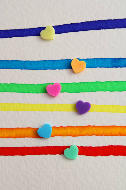 Colorful hearts on rainbow colored stripes