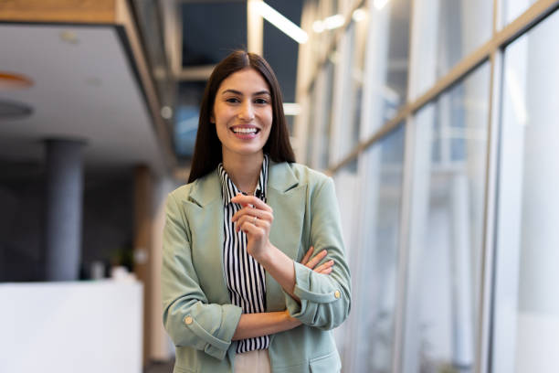 istock Elegant Latina entrepreneur with a warm smile in a modern office 2200219075