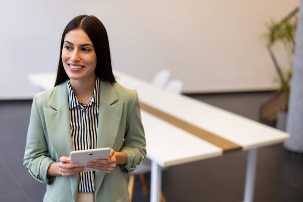 istock Businesswoman of Latin descent using a tablet 2200219077