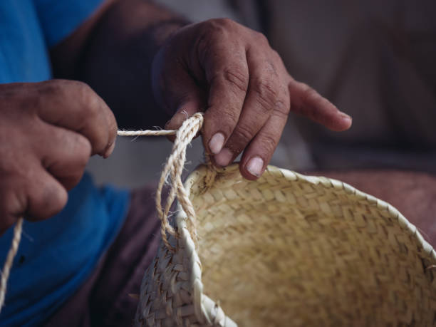 istock Skilled artisan crafting a traditional palmito basket 2200219141