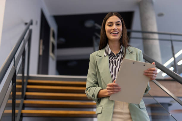 istock Successful Latina entrepreneur with a friendly smile in a business setting 2200219878