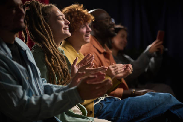 istock Group of People Applauding and Watching Something Together 2200220263